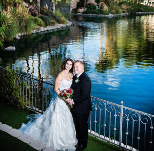 Couple posed next to gazebo