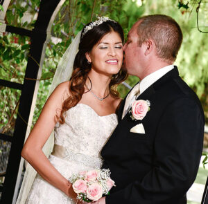 Couple kissing under gazebo